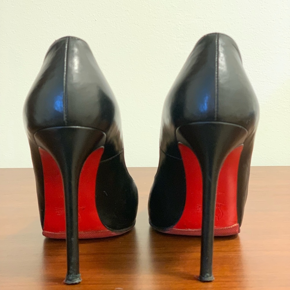 Christian Louboutin open toe pumps.